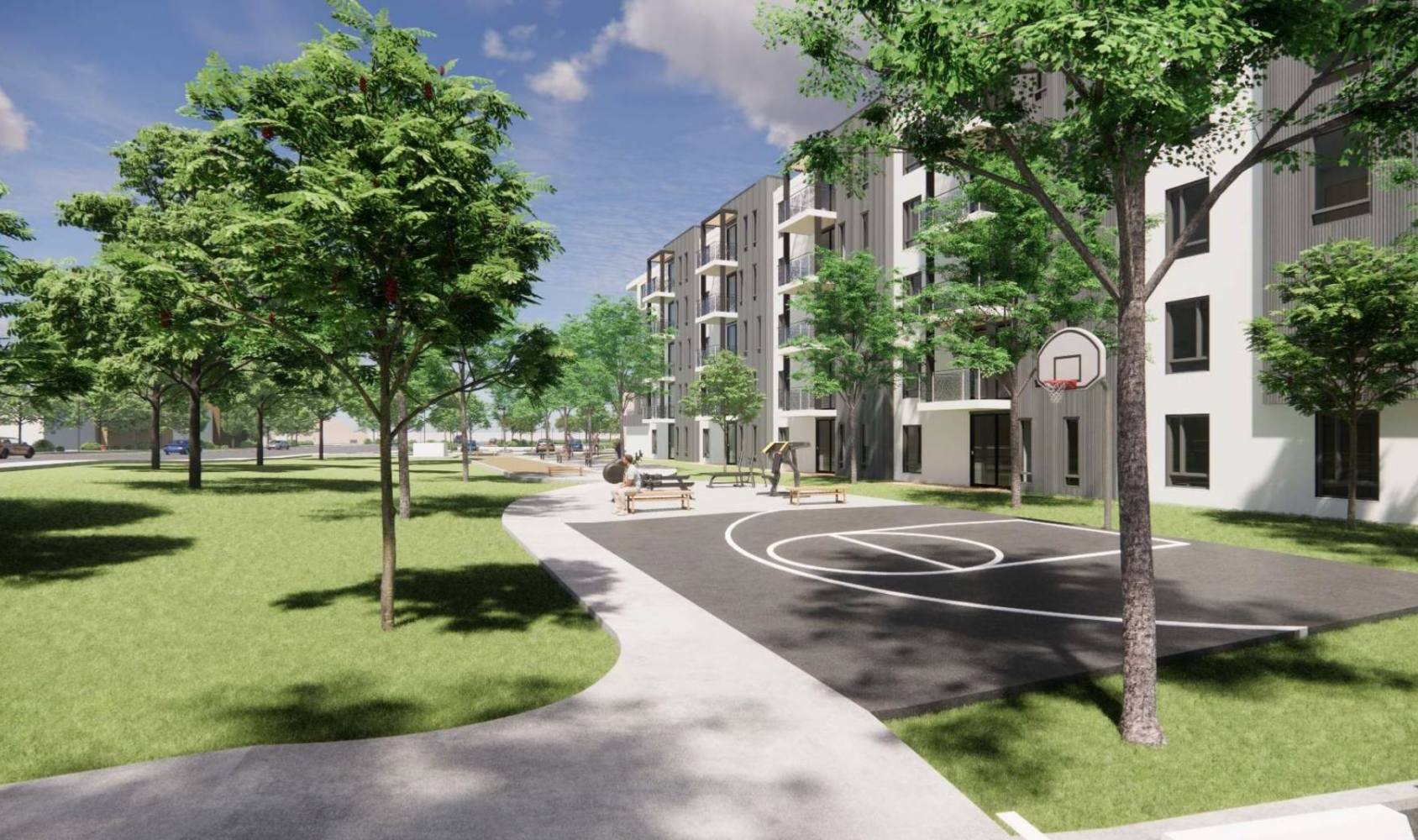 A modern apartment complex with several stories is surrounded by green lawns and trees. In the foreground is a small outdoor basketball court. The sky is partly cloudy, adding to the serene setting.