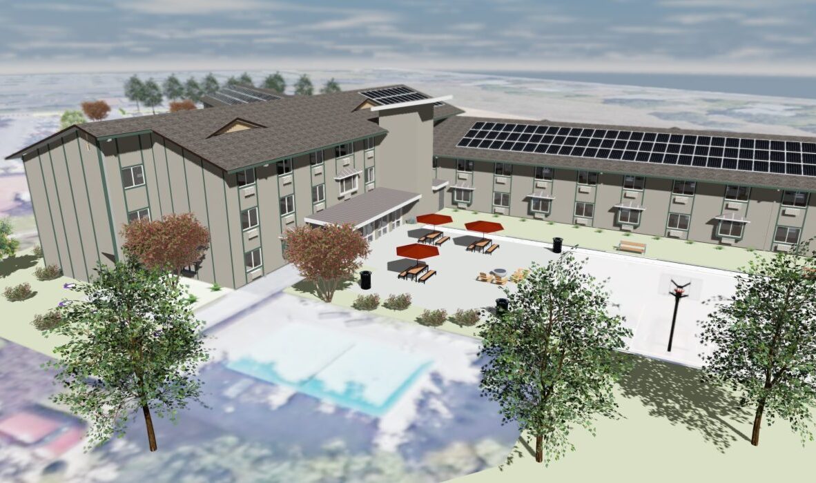A digital rendering of a modern, L-shaped building with solar panels on the roof. The courtyard features tables with red umbrellas and surrounding greenery. A blurred swimming pool is visible in the foreground.